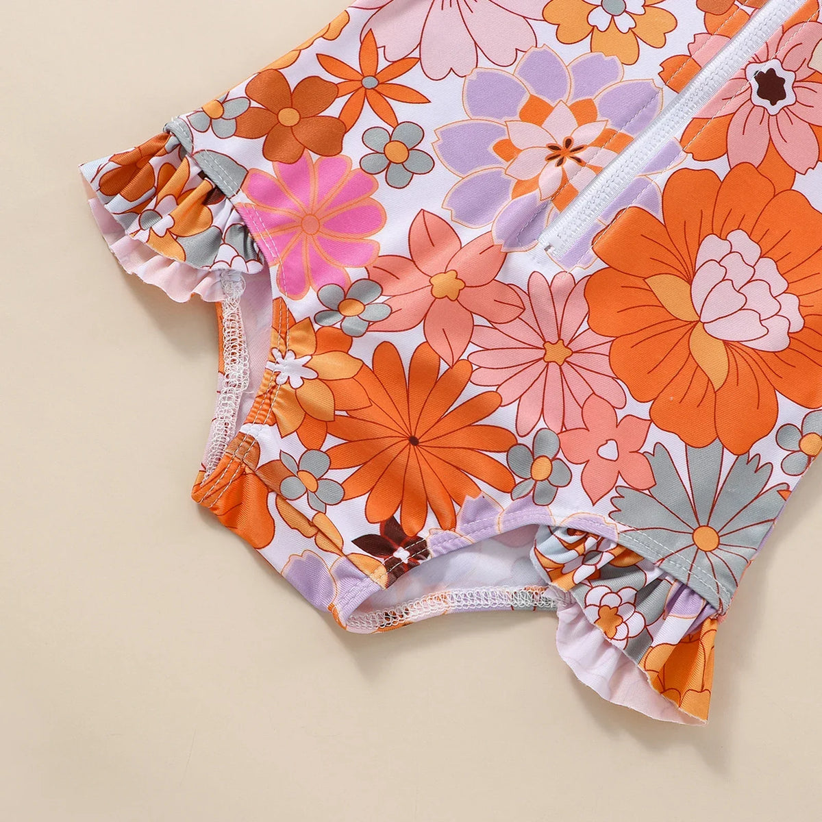 Maiô Bebê Menina Manga Longa com Zíper Frontal Estampa Floral e Babado